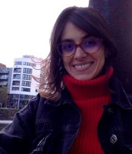 Liliana’s face, smilling, white skin, brown hair, wearing glasses