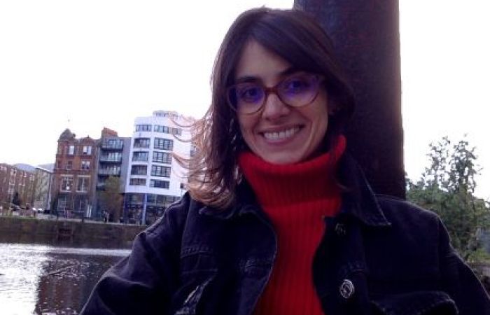 Liliana’s face, smilling, white skin, brown hair, wearing glasses